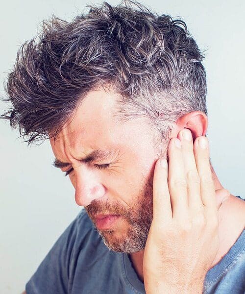 Man suffering from tinnitus